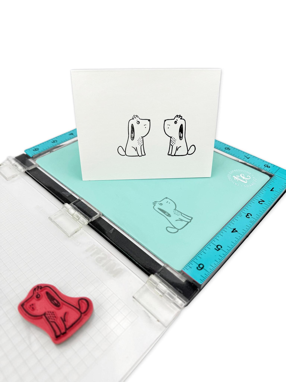Image of mirror mat being used to create a mirror of two stamps which is used for papercrafting.